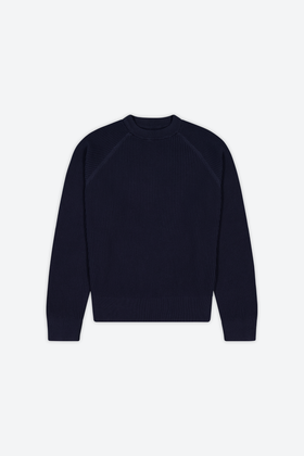 A navy ribbed raglan crewneck knit sweater on a plain background