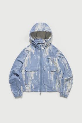 A light blue printed RCOS hooded technical shell jacket with utility chest pockets