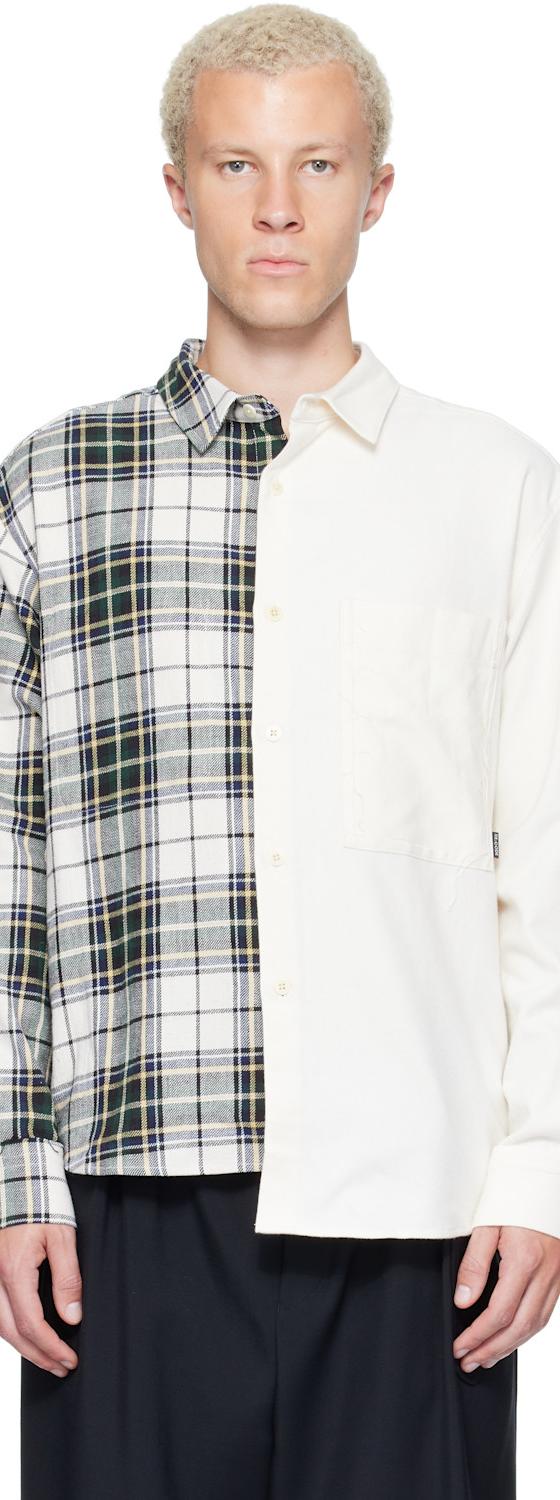 A man wearing a half-plaid, half-ivory spliced RE;CODE shirt with black trousers