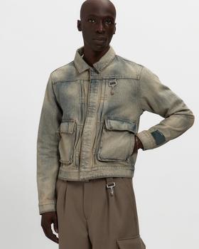 A man wearing a washed denim Reese Cooper utility jacket with cargo pockets over brown trousers