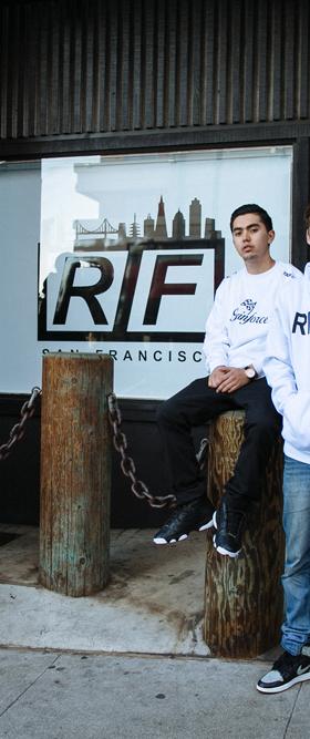 A group of young men wearing RIF LA hoodies and tees outside the storefront