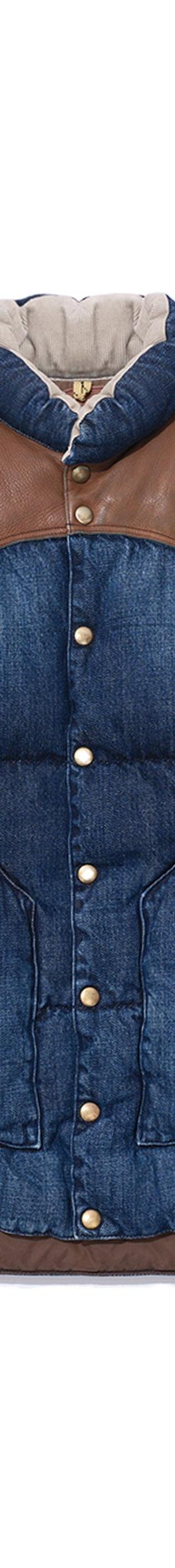 A Rocky Mountain Featherbed denim down vest with a brown leather western yoke