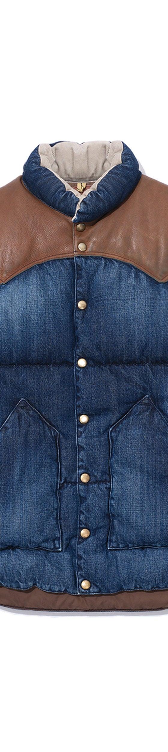 A Rocky Mountain Featherbed denim down vest with a brown leather western yoke