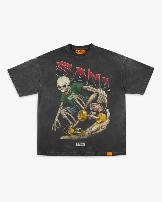 Front of SANA's washed black Skelly Skate Tee with a skeleton skater graphic