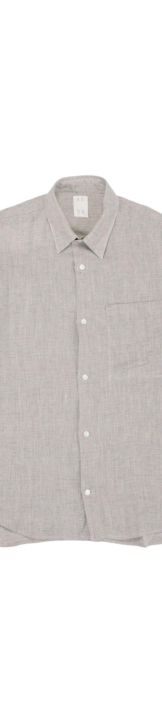 A pale grey seya. linen short-sleeve shirt on a white background