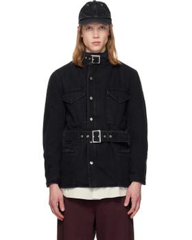 A man wearing a black belted denim jacket and cap by Silas