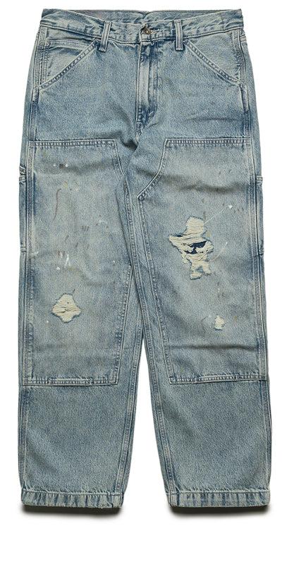 Light-wash distressed double-knee carpenter jeans on a plain white background