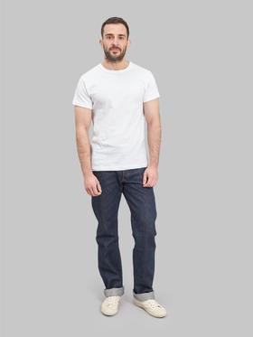 A man wearing Studio D'Artisan raw selvedge denim jeans with a white T-shirt