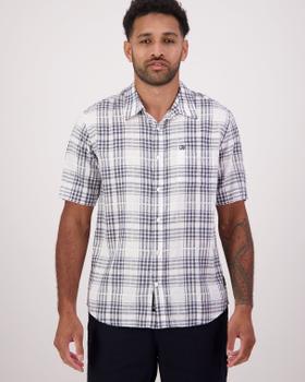 A man wearing a white and navy plaid short-sleeve Swanndri shirt