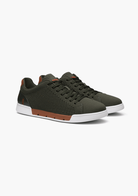 A pair of olive green SWIMS knit sneakers with white soles