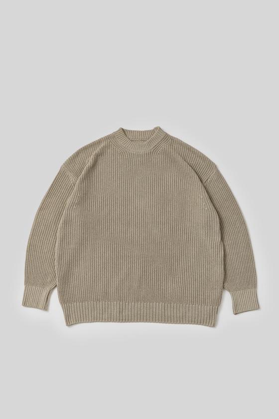 A beige ribbed mock-neck knit sweater by THE DAY