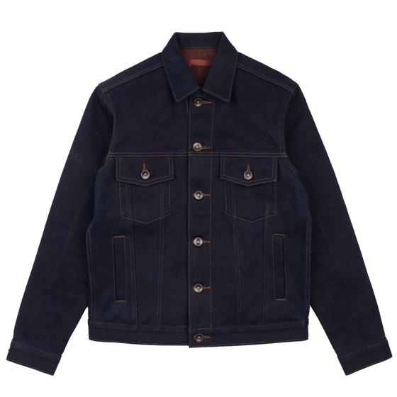 A raw indigo selvedge denim trucker jacket on a plain white background