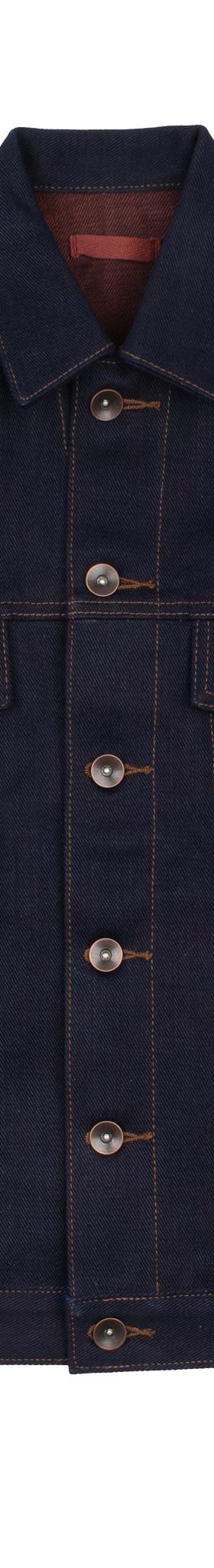 A raw indigo selvedge denim trucker jacket on a plain white background