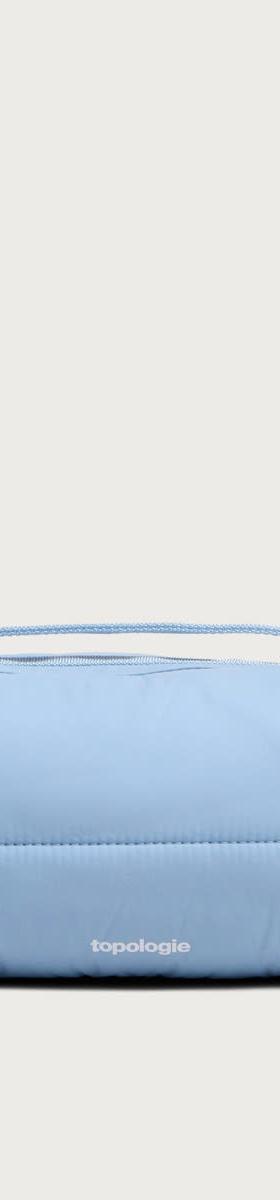 A pale blue Topologie padded shoulder bag with rope drawcords