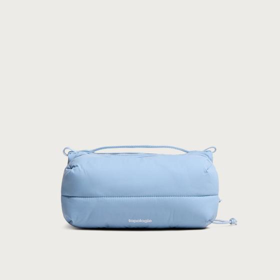 A pale blue Topologie padded shoulder bag with rope drawcords