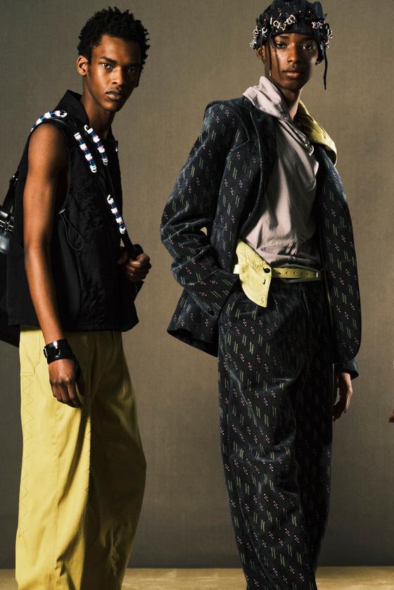 Two models wearing Trikko layered tailoring and printed suiting