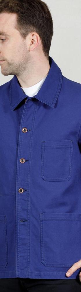 A man wearing a bright blue Vétra cotton chore jacket over a white tee