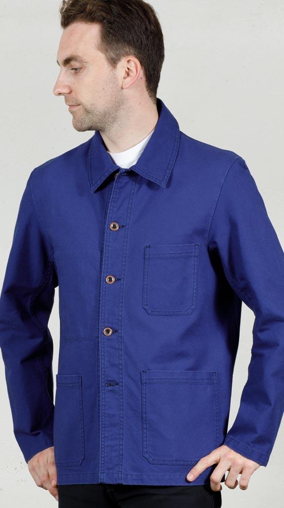 A man wearing a bright blue Vétra cotton chore jacket over a white tee