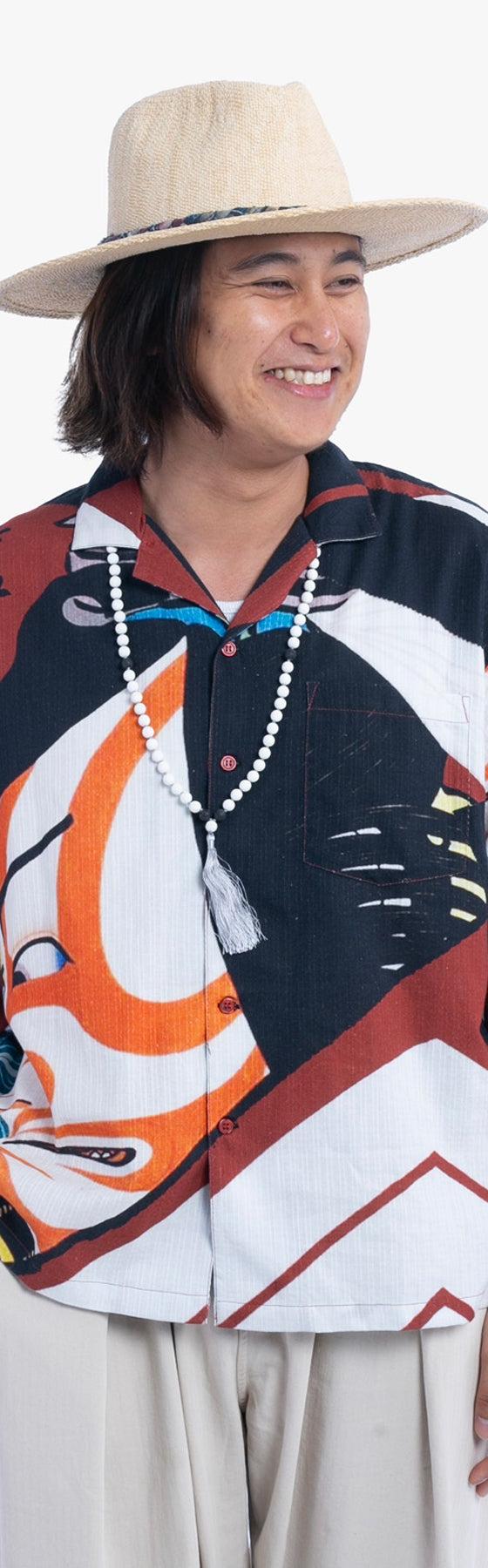 A man wearing a Wa-Modern short-sleeve shirt printed with a traditional Japanese ukiyo-e motif