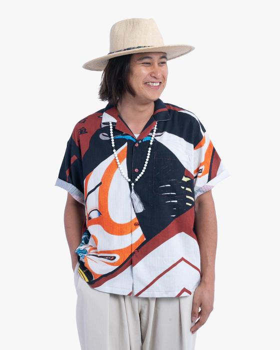 A man wearing a Wa-Modern short-sleeve shirt printed with a traditional Japanese ukiyo-e motif