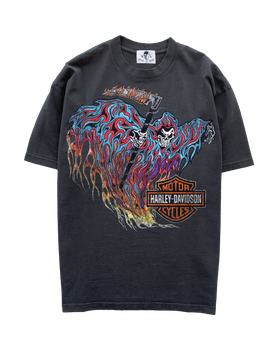 A faded black Warren Lotas t-shirt with a skull-and-flames graphic print