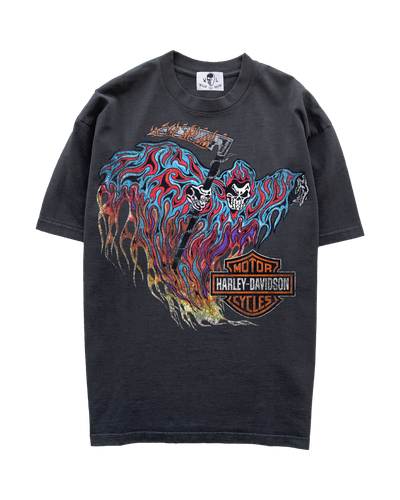A faded black Warren Lotas t-shirt with a skull-and-flames graphic print