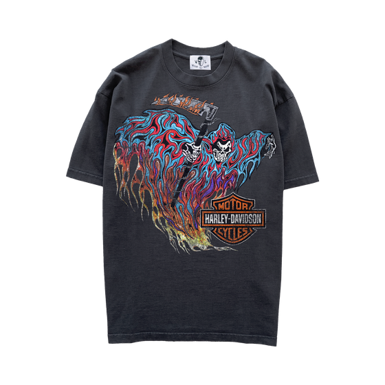 A faded black Warren Lotas t-shirt with a skull-and-flames graphic print