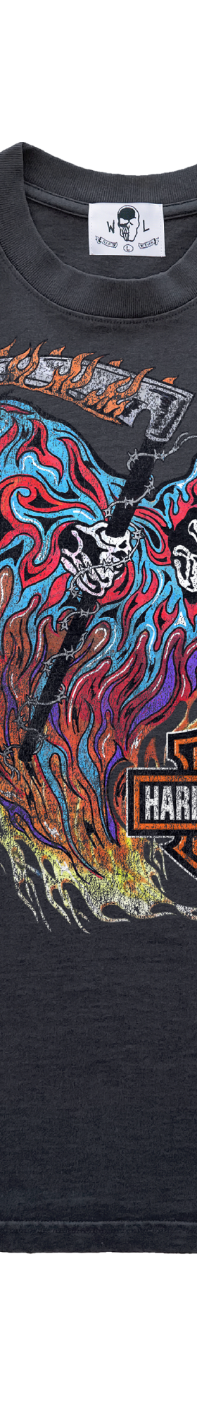 A faded black Warren Lotas t-shirt with a skull-and-flames graphic print