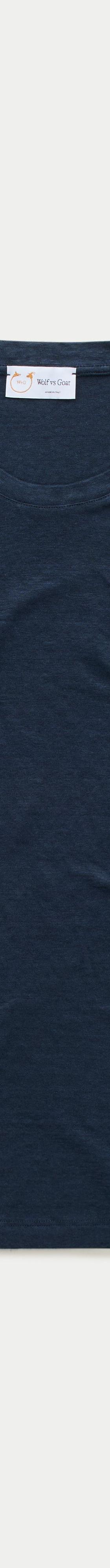 A navy slub-cotton crewneck T-shirt by Wolf vs Goat photographed on a plain off-white background