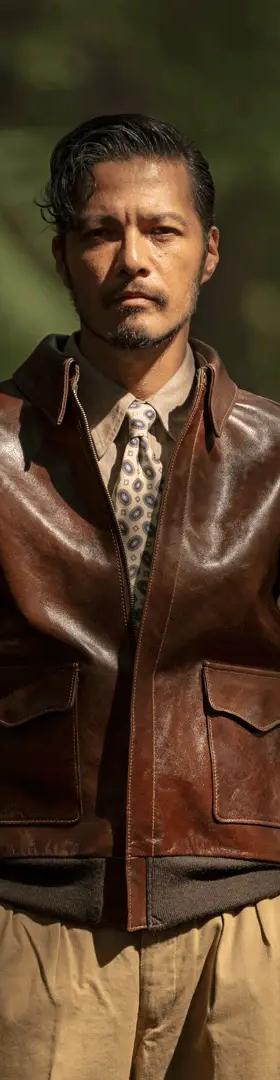 A man wearing a brown Y'2 Leather horsehide flight jacket