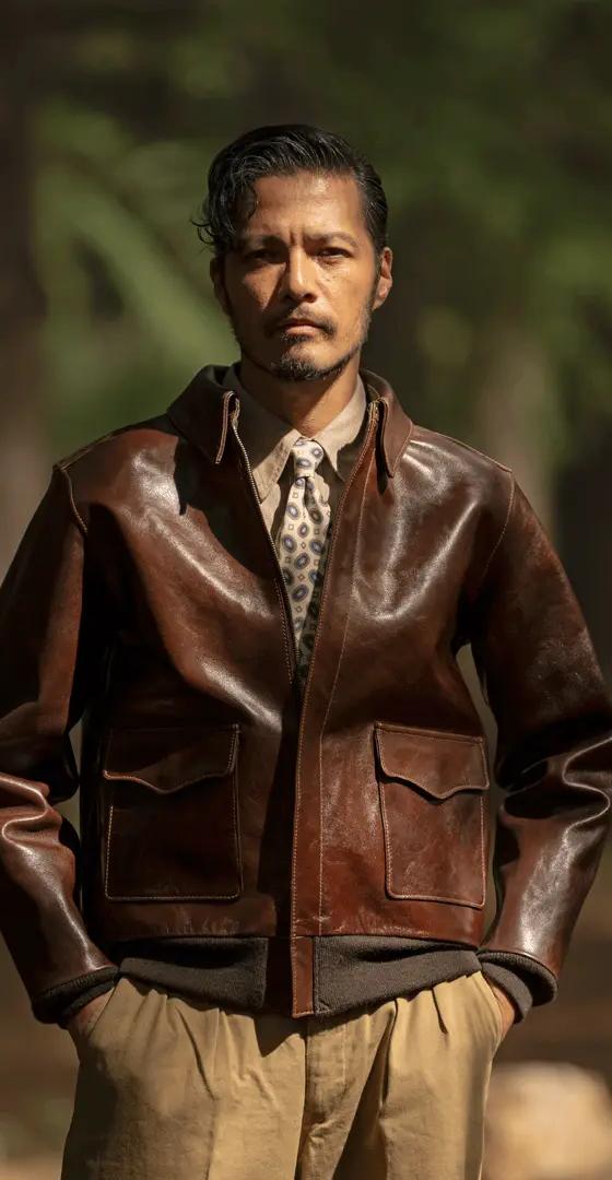 A man wearing a brown Y'2 Leather horsehide flight jacket