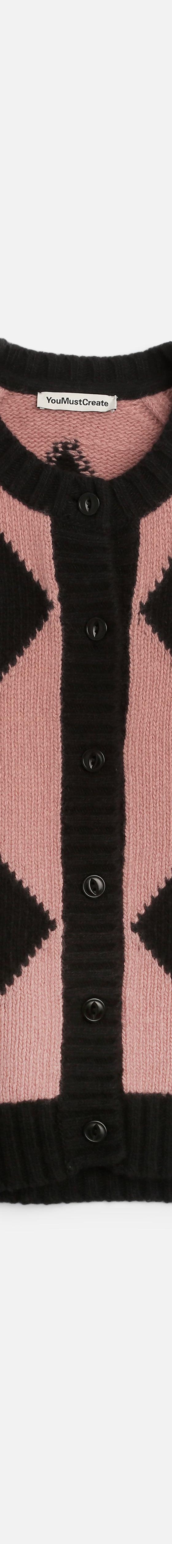 A pink and black diamond-patterned YMC knitted cardigan on a plain white background