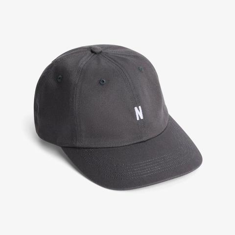 A grey Norse Projects cotton twill sports cap with a small white embroidered N