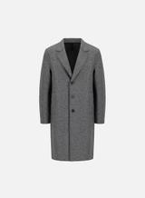 A men's mid-grey pressed wool single-breasted overcoat with notch lapels and three buttons, fastened, shown from the front on a plain pale grey background.