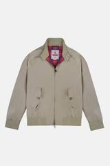 A tan Baracuta G9 Harrington jacket laid flat on a white background, its zip partly open at the neck to reveal the red Fraser tartan lining and Baracuta label, with buttoned slanted flap pockets and ribbed cuffs and hem.