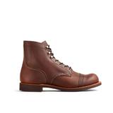 A single brown leather cap-toe work boot shown in side profile on a white background, with metal eyelets running all the way up the dark laces, a stitched welt, and a dark brown stacked sole.
